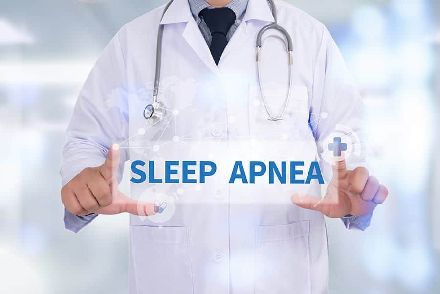 picture of doctor holding sleep apnea sign from neck down