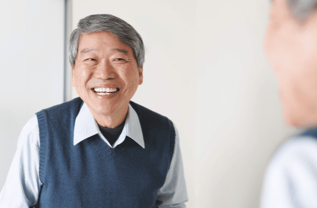 asian senior man smile and look his healthy teeth